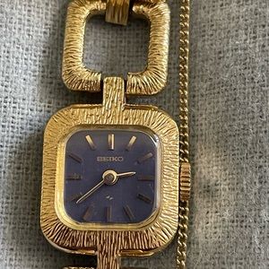 Seiko watch, blue face, gold bracelet. Sterling silver back. Needs battery